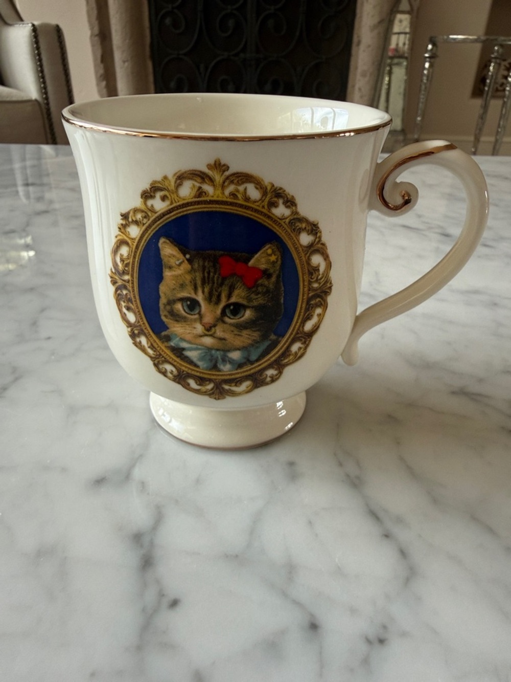 Cute new graphic kitty mug with gold accents.
